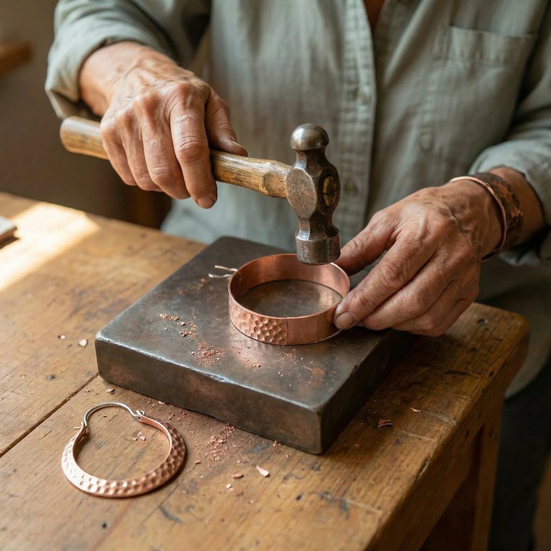 Artisan copper hoop earrings with hammered texture and curved crescent shape