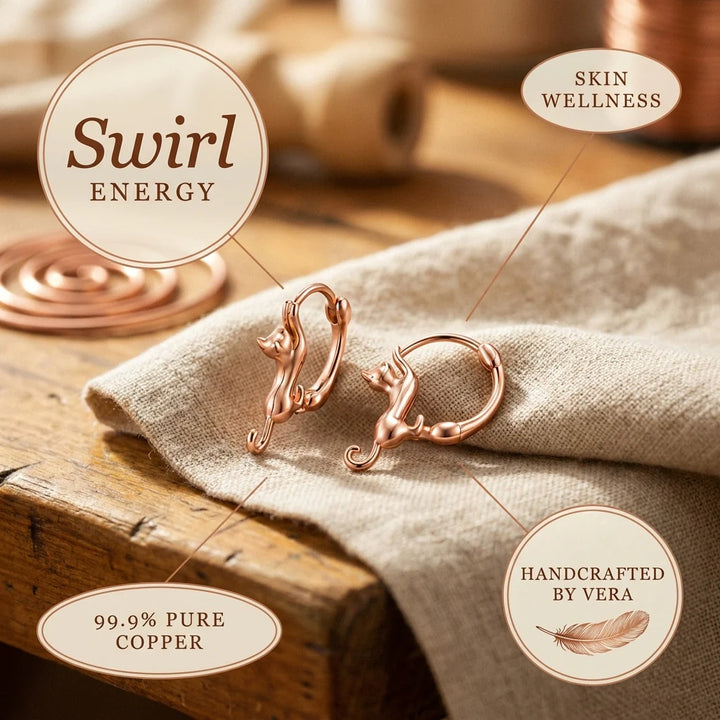 Pair of rose gold hoop earrings featuring hand-formed curves and metallic rose gold tone