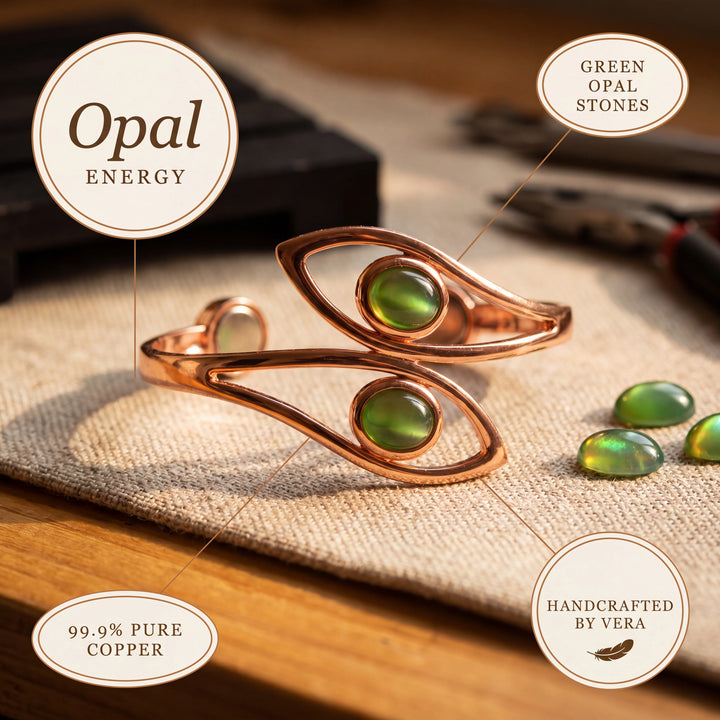 Copper cuff bracelet with smooth finish and green stone accents on natural linen fabric