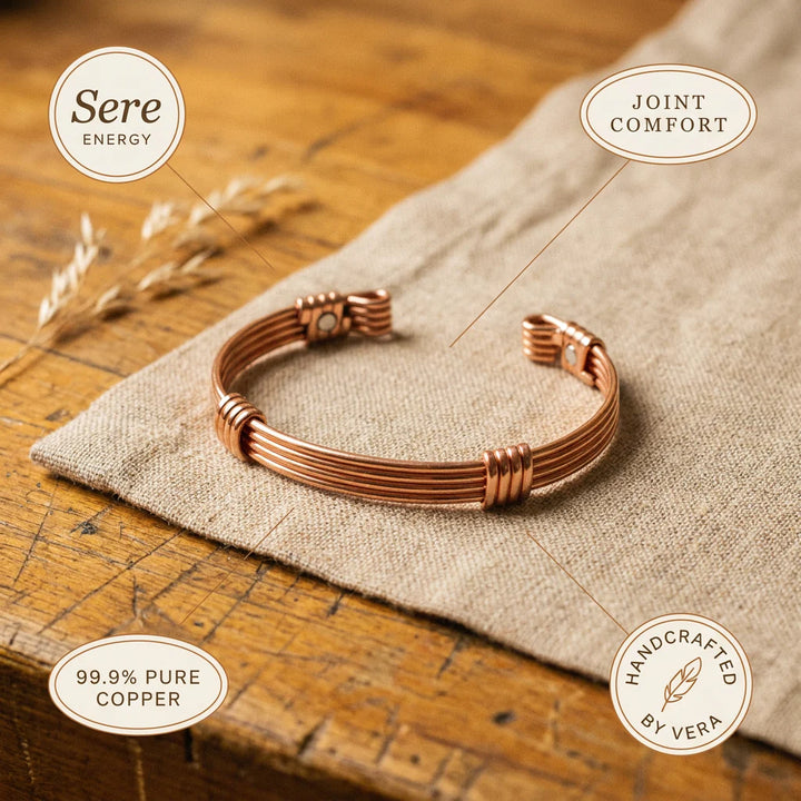 Women's copper bracelet with hand-wound wire accents and structured band design