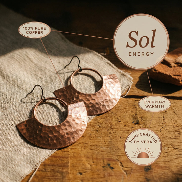 Handcrafted copper drop earrings with warm metallic finish and textured surface detail