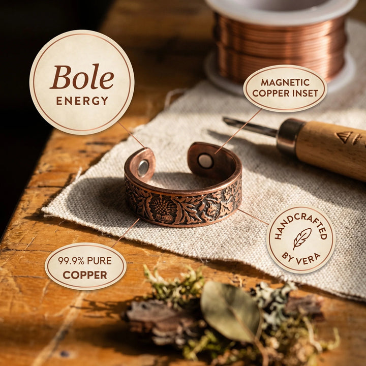 Adjustable copper cuff ring with embossed detailing photographed from side angle