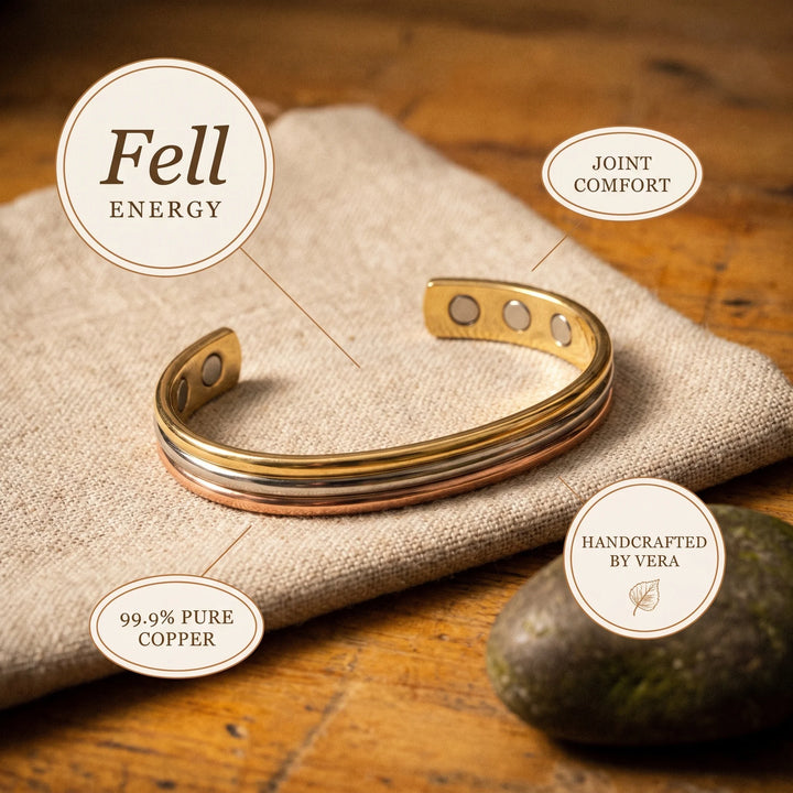Detail of tri-tone copper bracelet with embedded magnets visible through circular openings