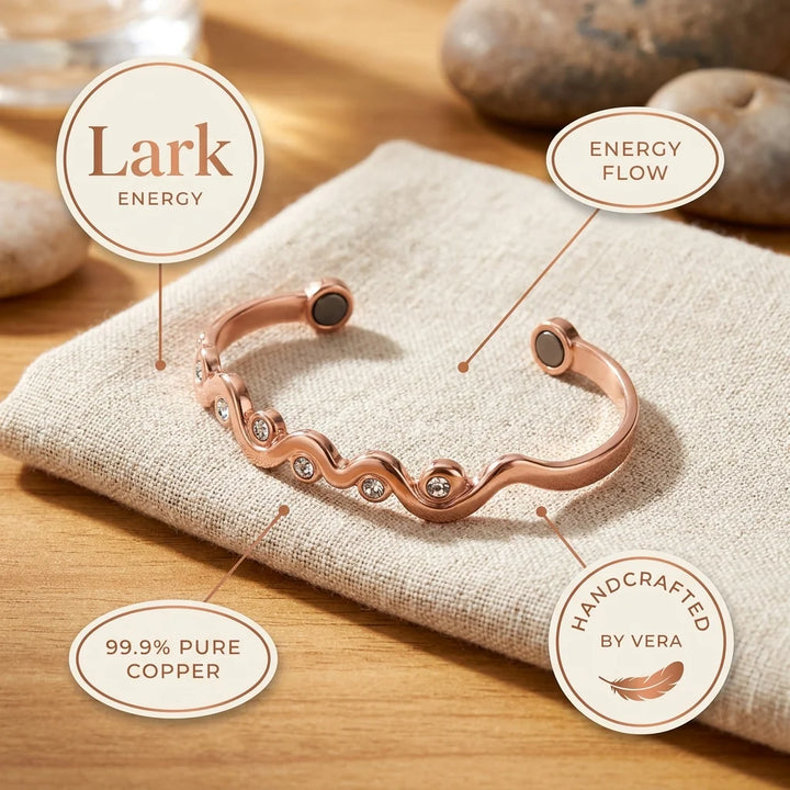 Adjustable open cuff bracelet in polished copper with flowing wave motif and clear crystals