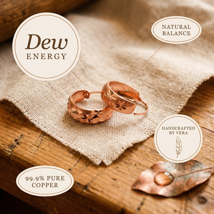 Star engraved hoop earrings displayed with jewellery-making tools showing artisan craftsmanship
