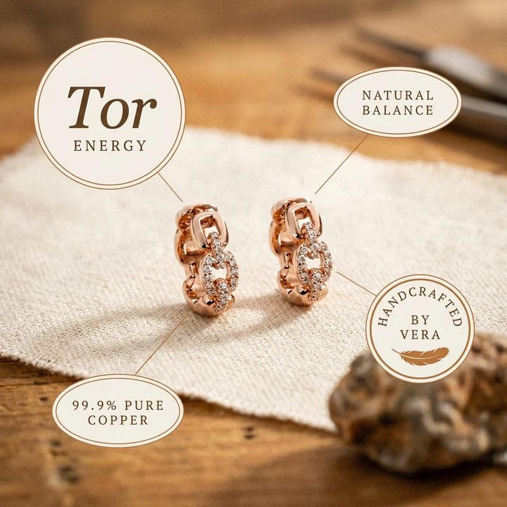 Overhead view of statement chain link hoop earrings showing alternating crystal and smooth segments