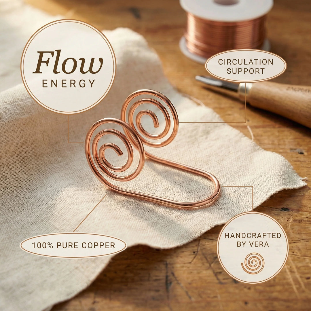 Copper hand cuff with spiral design resting on linen fabric showing adjustable wire tail construction